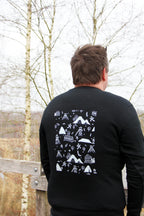 Sweatshirt unisexe noir Patrimoine minier porté de dos, motifs terrils et chevalements imprimés